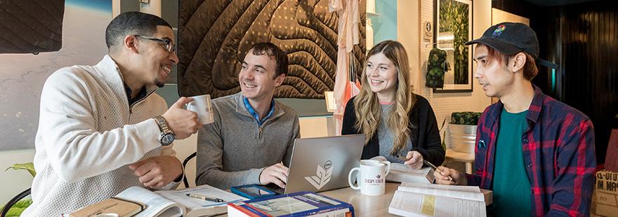 SPU grad students study together in a coffee shop | photo by Dan Sheehan